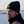 Load image into Gallery viewer, man in black fishing Watch Cap by Hook Life at a harbor
