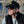 Load image into Gallery viewer, man in black Anglers Pride Tugboat Trucker fishing cap by Hook Life at a harbor
