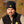 Load image into Gallery viewer, man wearing black fishing Watch cap by Hook Life with fall foliage
