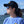 Load image into Gallery viewer, young woman in black Anglers Pride Tugboat Trucker fishing cap at a marina
