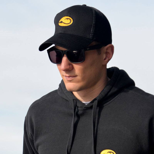 young man in black Anglers Pride Tugboat Trucker fishing cap by Hook Life