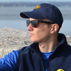 young man wearing navy Skipper fishing cap by Hook Life